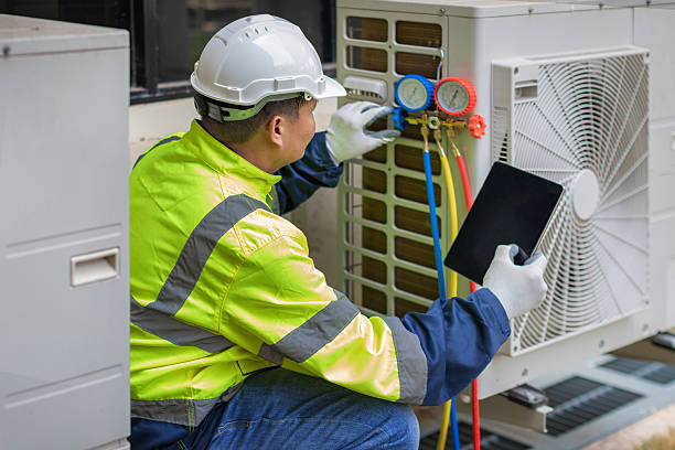Professional Heat Pump Repair technician working in North Falmouth, MA